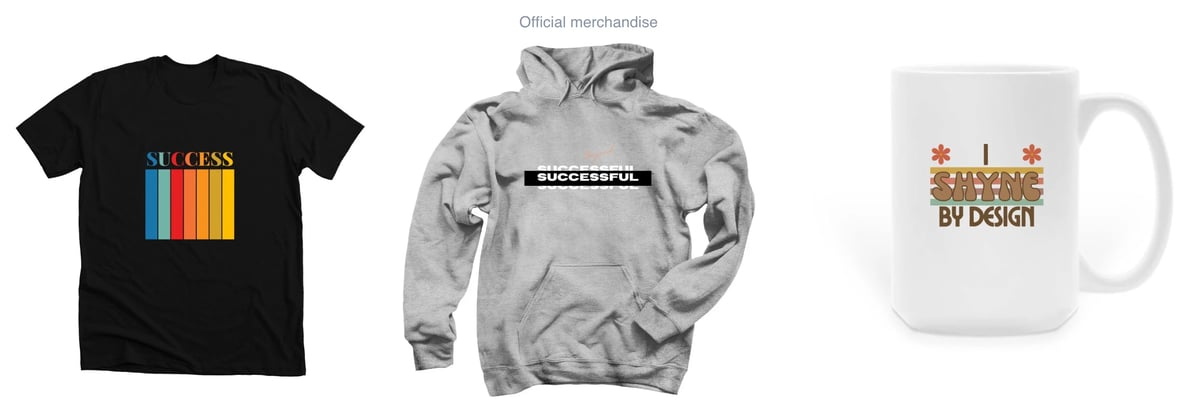 Three merchandise items displayed: black t-shirt with colorful success design, gray hoodie with tech graphics, and white mug with seasonal built by design text